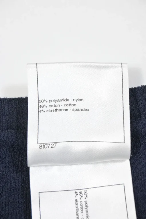 Navy bow-embellished polyamide-blend racked knit short sleeve top
