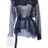 Navy semi-sheer polyester mixed-media peek-a-boo pussy-bow peplum blouse with pinutck ruffle bib
