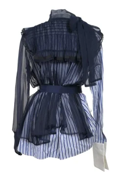 Navy semi-sheer polyester mixed-media peek-a-boo pussy-bow peplum blouse with pinutck ruffle bib