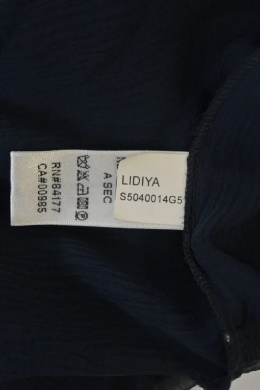 Navy semi-sheer silk Lidiya flutter sleeve peplum blouse with button-loop fastening at centre front