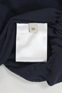 Navy semi-sheer tie-front keyhole peplum blouse with drawstring waist