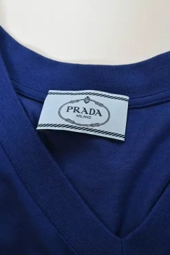 Navy silk jersey knit V-neck sleeveless pullover blouse with striped scye tipping