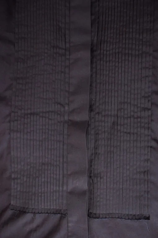 Navy sleeveless top with pleated panels