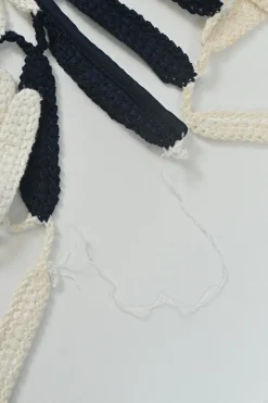 Navy viscose-blend striped crochet knit tiered column illusion maxi dress with side cutouts and tassel skirt
