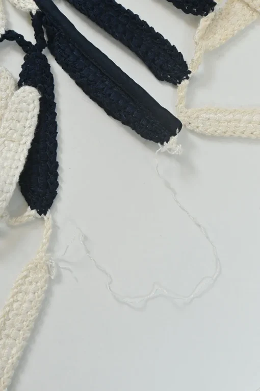 Navy viscose-blend striped crochet knit tiered column illusion maxi dress with side cutouts and tassel skirt