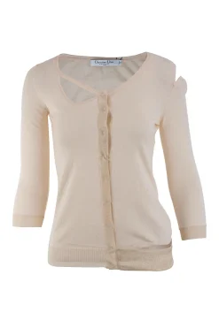 Off white cashmere and silk cold shoulder sweater with snap buttons.