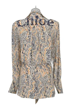 Orange abstract swirl print plunge neck tie-front logo tunic with dagger collar and bishop sleeves