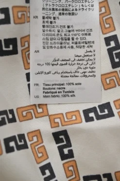 Orange and brown silk geometric print pussy-bow blouse