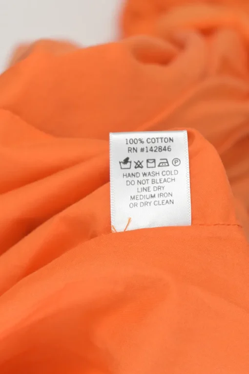 Orange cotton Casey tasseled mini A-line ruffle dress with twisted tie-waist fastening
