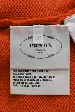 Orange crewneck pullover sweater featuring logo broderie motif