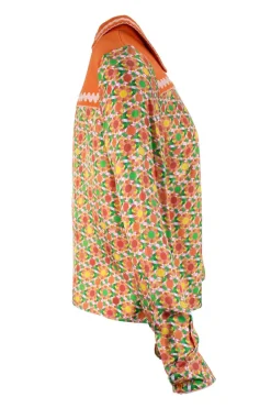 Orange long sleeve, silk and cotton top with polo collar and green geometrical pattern