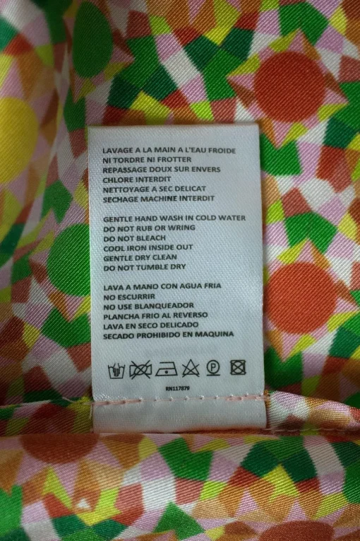 Orange long sleeve, silk and cotton top with polo collar and green geometrical pattern
