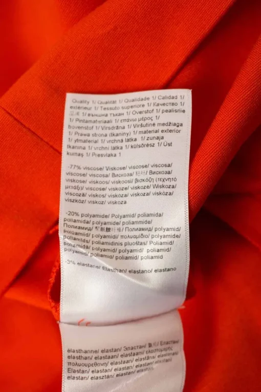 Orange mid-length sleeve knee-length dress with side pleats. Feature zipper closure at the back