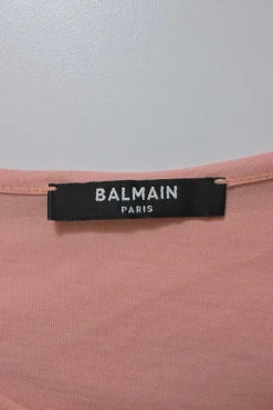 Peach screen-printed cotton jersey knit sleeveless flocked logo top with gold-finish metallic shank button shoulder line appliqué