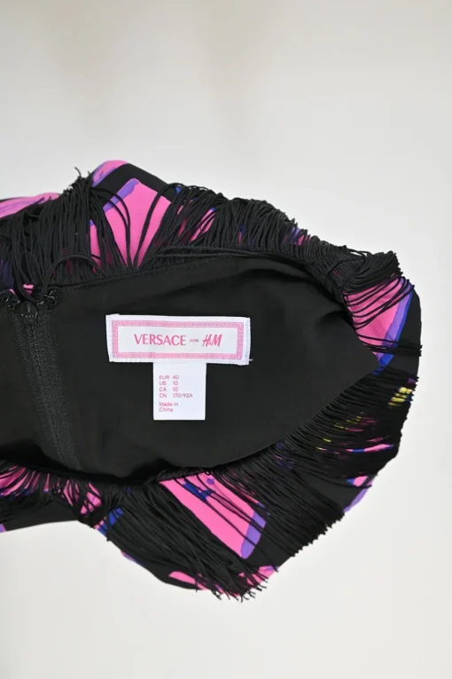 Pink and black silk heart print sleeveless mini dress with contrasting tassel trim appliqué
