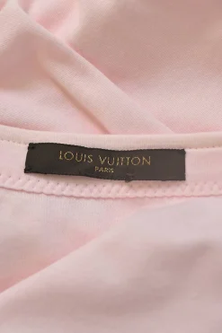 Pink bow-embellished jersey knit tank top featuring house code charm appliqué