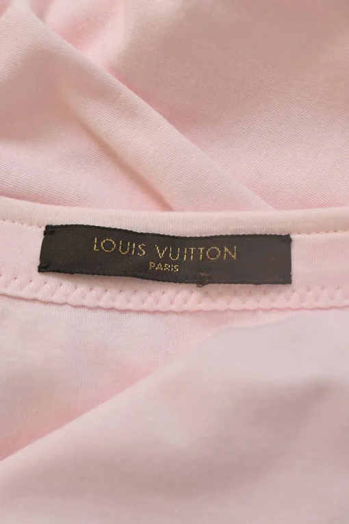 Pink bow-embellished jersey knit tank top featuring house code charm appliqué