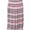 Pink silk drop-waist pleated midi skirt featuring cursive logo motif