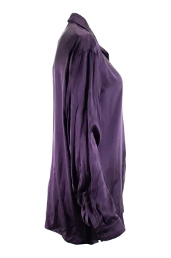 Purple long-sleeved top gathered on one side