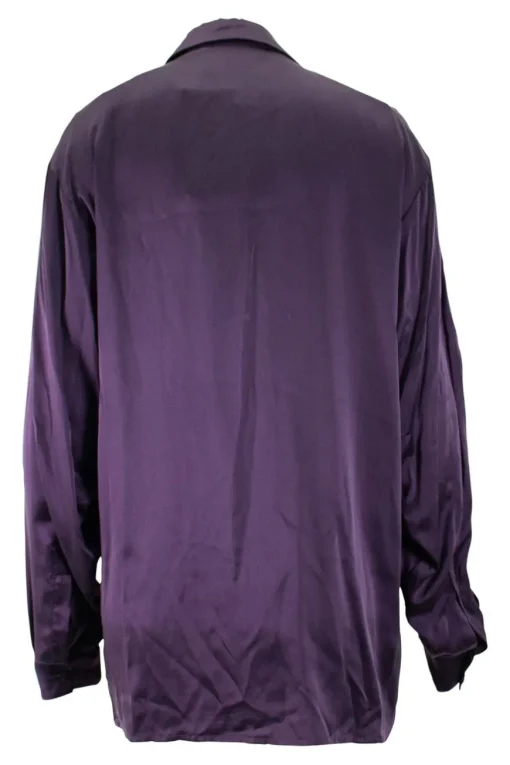 Purple long-sleeved top gathered on one side