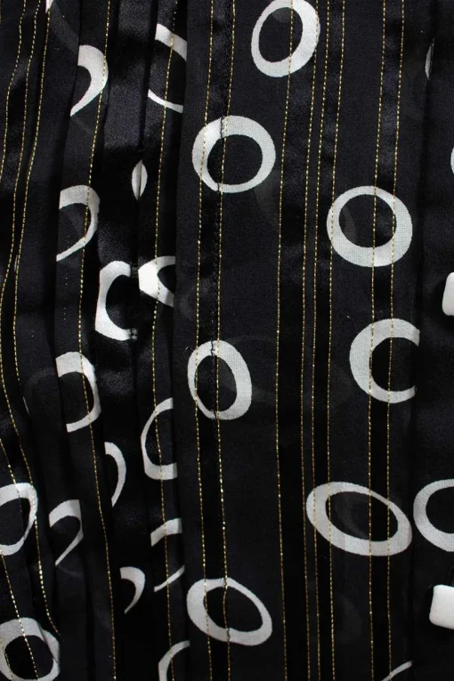Raquel mid-length button up silk dress in black with white circles and gold detailing