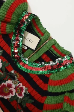 Red and black embellished wool striped rib knit pullover ruffle sweater featuring novelty broderie motif