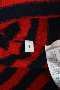 Red and black embellished wool striped rib knit pullover ruffle sweater featuring novelty broderie motif