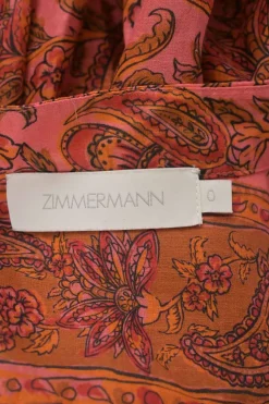 Red and orange cotton floral paisley print band collar button-front swing-style top with blouson sleeves