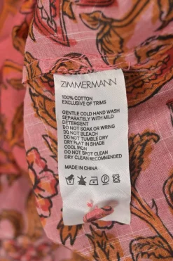 Red and orange cotton floral paisley print band collar button-front swing-style top with blouson sleeves
