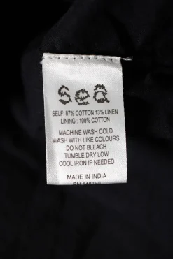 Sea, New York long sleeve, button down cotton dress with frill collar, diamond pleating and drawstring at waist