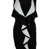 Sleeveless black dress with white ruffles