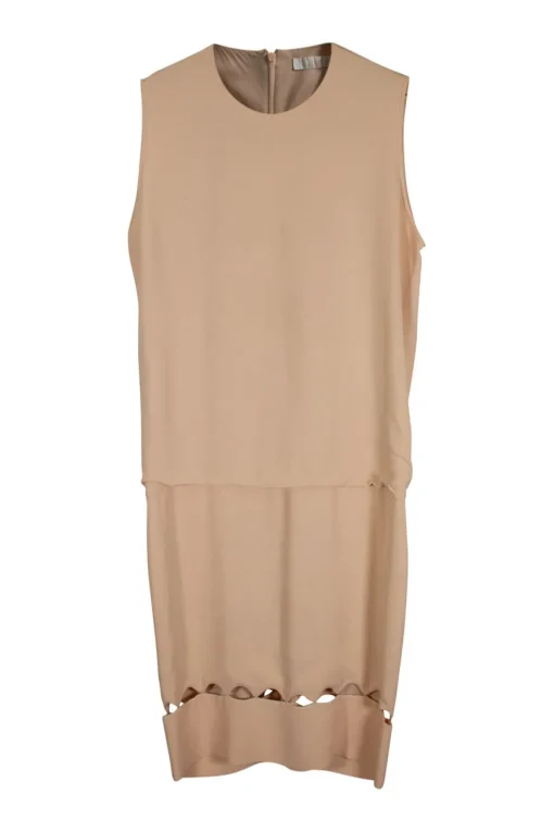Sleeveless round neck shift midi dress with dropped waist and cut out pattern around hem