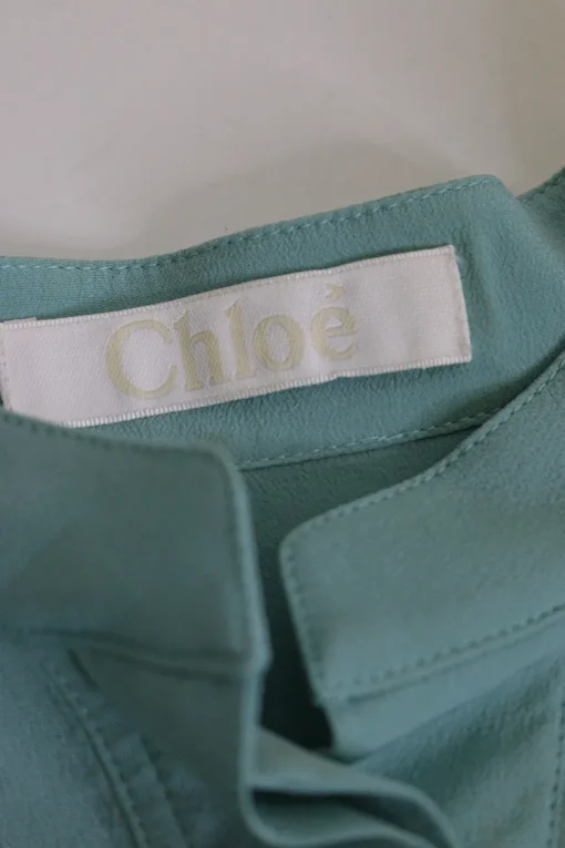 Teal silk band collar half-button pullover blouse