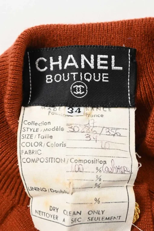 Terracotta cashmere interlock jersey knit funnel neck half-button pullover sweater with Coco Mark shank buttons