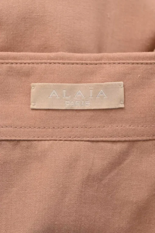Terracotta cotton-blend point collar button-front peplum blouse with drawstring waist and tiered laser-cut plissé hem