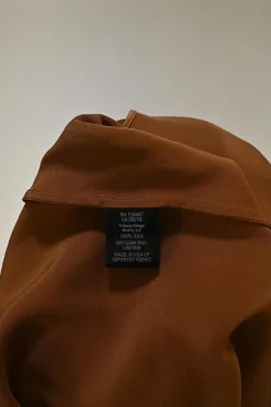 Terracotta silk slip-style camisole with adjustable spaghetti straps