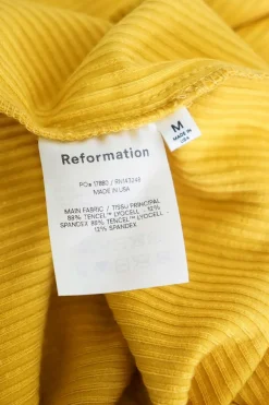 Turmeric yellow Tencel-blend rib knit slip dress with ruched side details and fixed spaghetti straps