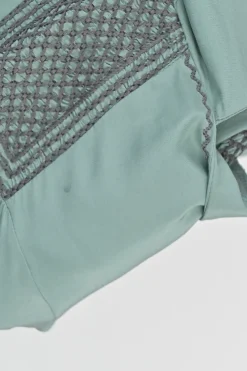 Turquoise silk symmetrical geometric pattern spread collar v-neck long sleeve gathered button cuff blouse with side concealed zipper