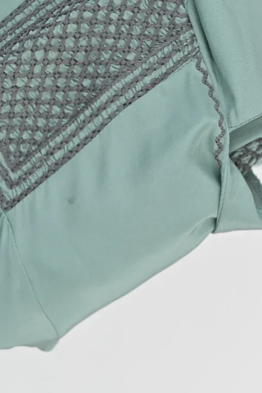 Turquoise silk symmetrical geometric pattern spread collar v-neck long sleeve gathered button cuff blouse with side concealed zipper