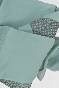 Turquoise silk symmetrical geometric pattern spread collar v-neck long sleeve gathered button cuff blouse with side concealed zipper