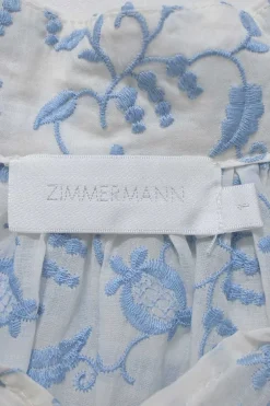 White and blue floral-embroidered semi-sheer cotton lawn half-sleeve swing-style top with button-loop high neck and scalloped edges
