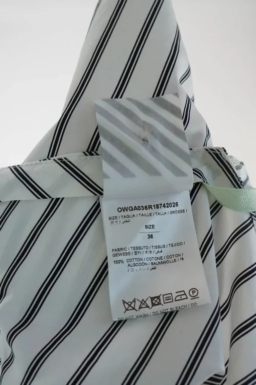 White and dark navy bias-cut striped cotton poplin classic collar sleeveless handkerchief blouse
