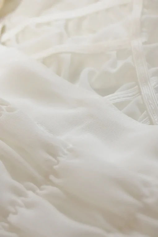 White asymmetric ruched spread collar button-front shirt
