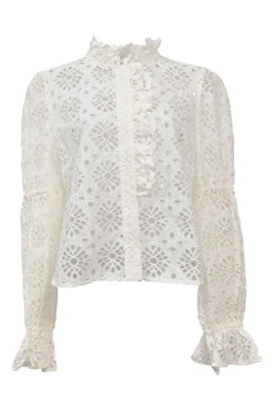 White broderie Anglaise peek-a-boo blouse with ruffled collar, flounce cuffs, and concealed placket