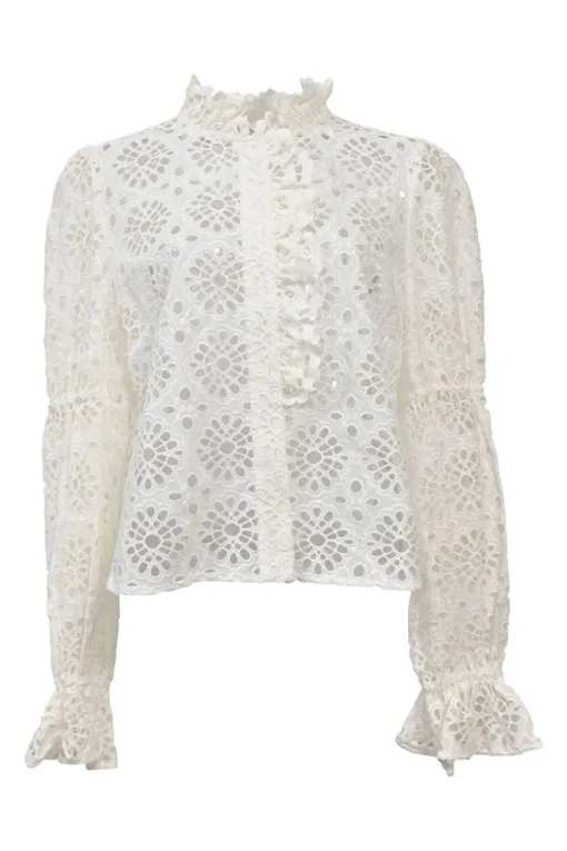 White broderie Anglaise peek-a-boo blouse with ruffled collar, flounce cuffs, and concealed placket