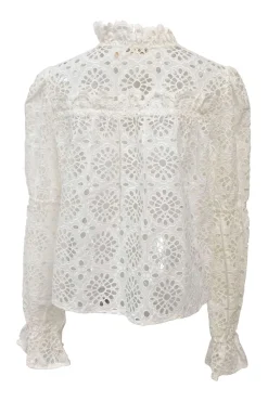 White broderie Anglaise peek-a-boo blouse with ruffled collar, flounce cuffs, and concealed placket