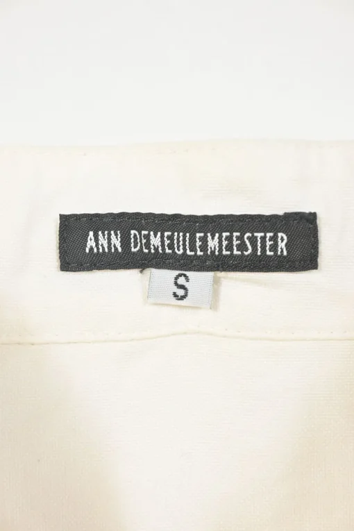White cotton button-front shirt featuring Oxford-style collar and concealed button placket