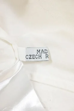 White cotton button-front shirt featuring Oxford-style collar and concealed button placket