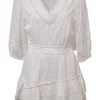 White cotton clip jacquard plunge neck blouson mini dress with cropped sleeves and tier ruffle skirt