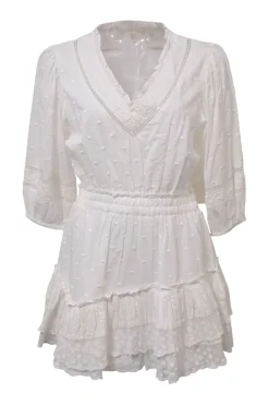 White cotton clip jacquard plunge neck blouson mini dress with cropped sleeves and tier ruffle skirt